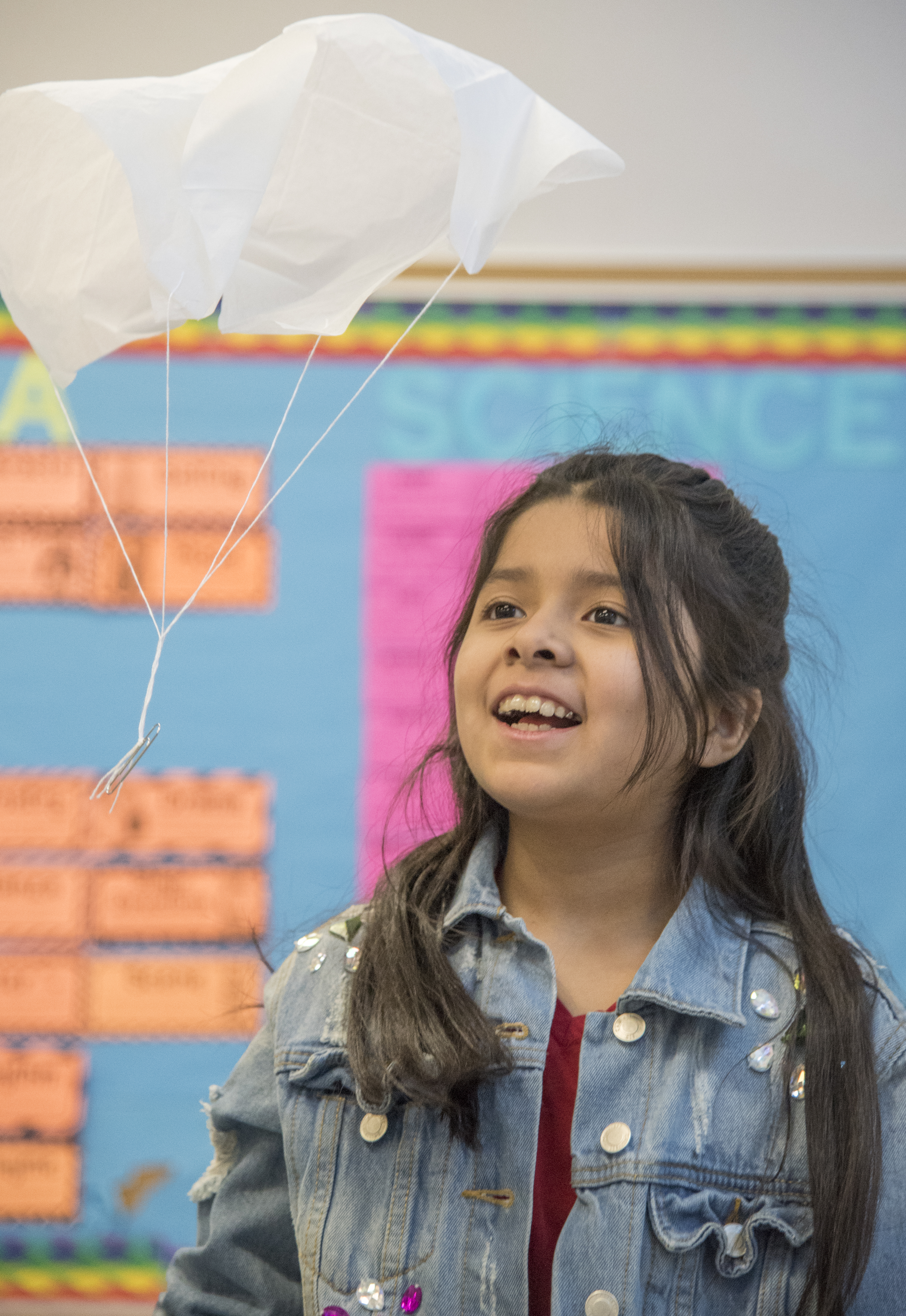 A child watches a parachute fall